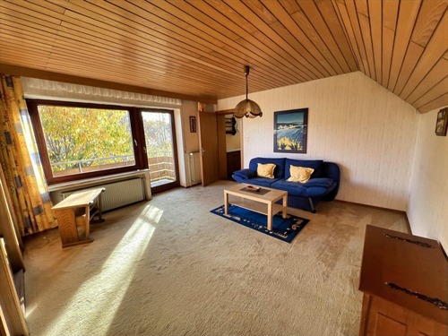 Wohnzimmer DG mit Balkonzugang - 