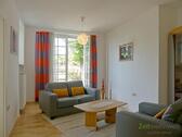 Wohnzimmer mit Gartenausgang - (EF0412_M) Dresden: Radebeul, exklusive 3-Zimmerwohnung in Stadtrandvilla mit Blick über das Elbtal bis Dresden