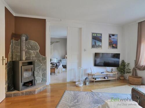 Blick zu Kamin und Schlafzimmer - Etagenwohnung mit 75,00 m² in Biederitz zur Miete