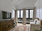 Sofa und TV mit Winteraussicht - 2 Zimmer Etagenwohnung zur Miete in Kassel