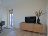 Blick zu Balkon und TV - (EF1205_M) Magdeburg: Herrenkrug, Erstbezug in neu gebaute und neu möblierte Wohnung mit Balkon und Aufzug