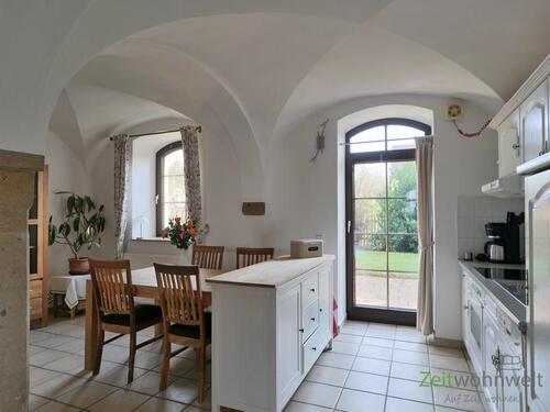 Blick zu Küche und Terrassenausgang - 