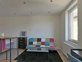 Sofa hinter dem Raumteiler - 1 Zimmer Etagenwohnung in Kassel