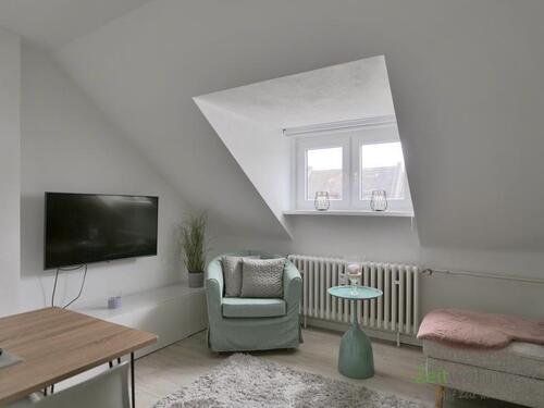 Blick ins Wohnzimmer - (EF1240_M) Kassel-Stadt: Kirchditmold, neu möblierte 3-Zimmer-Wohnung mit Dusche, Waschmaschine und PKW-Stellplatz