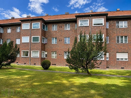 Rückansicht 1 - Mariendorf - Bezugsfreie Wohnung mit Dielen und Wintergarten in denkmalgeschützter Wohnanlage