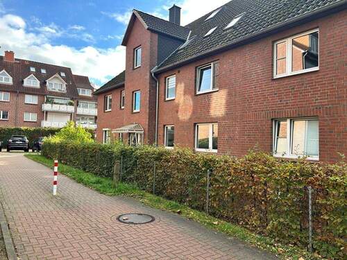 Hausansicht - Ruhige 2-Zimmer-Terrassenwohnung mit Tiefgarage im Herzen von Buchholz