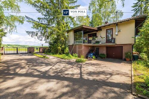 Titelbild - Charmantes Einfamilienhaus auf parkähnlichem Grundstück