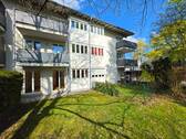 Gartenanteil und Hausansicht - 2-Zimmer-Gartenwohnung in bester Wohnlage Lage in Ottobrunn