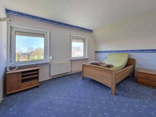 Zimmer im Dachgeschoss - 