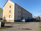 Hausansicht B.1 - 3- Raum- Erdgeschosswohnung in der Gemeinde Wermsdorf zu verkaufen
