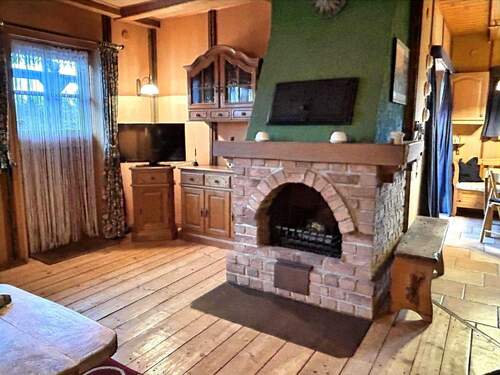 Kamin im Wohnzimmer - Einfamilienhaus mit 92,00 m&sup2; in Timmendorfer Strand zum Kaufen