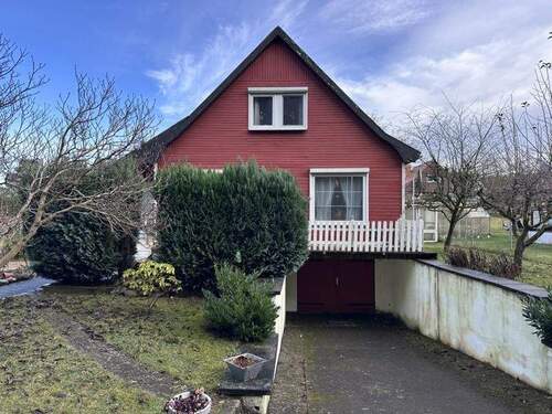 Ansicht west mit Garagenzufahrt - 