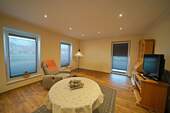 Wohnzimmer - Bungalow mit 100,00 m&sup2; in Uplengen zur Miete