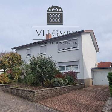 Bild 1 - Zweifamilienhaus in St. Ingbert-Hassel - gepflegtes Wohnhaus mit großem Garten und flexibler Nutzung