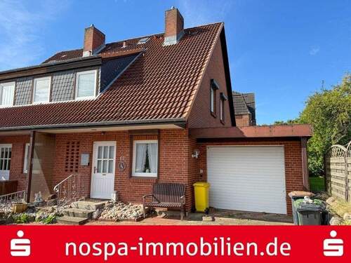 Straßenansicht - Teilweise unterkellertes Reihenendhaus mit Garage und Terrasse im beliebten Stadtteil Rödemis