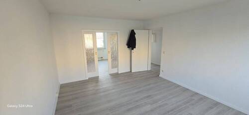 Wohnzimmer einer Wohnung im 1.OG - 