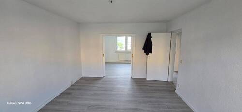 Wohnzimmer einer Wohnung im 1.OG - 