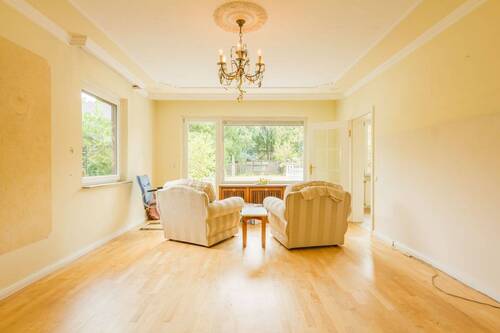 Wohnzimmer mit Sitzecke - Einfamilienhaus mit 86,00 m² in Hamburg / Sasel zum Kaufen