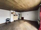 Wohnzimmer EG mit Kachelofen - 