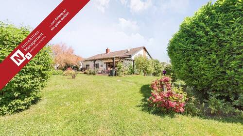 Titelbild - Einfamilienhaus im Bungalowstil mit Garage und tollem Garten