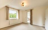 Schlafzimmer 1 im Obergeschoss mit Loggia - 