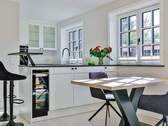 Essbereich im Wohnraum mit Blick zur offenen Küche - Mehrfamilienhaus, Wohnhaus mit 132,00 m² in Tinnum zum Kaufen