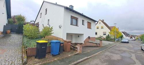 Bild 1 - Großzügige Erdgeschoss- und Untergeschosswohnung mit Garten, Pool & Garage in Oberrodenbach