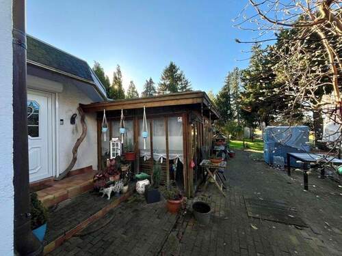 Eingangsbereich mit überdachter Terrasse - 6 Zimmer Einfamilienhaus zum Kaufen in Hamburg Billwerder