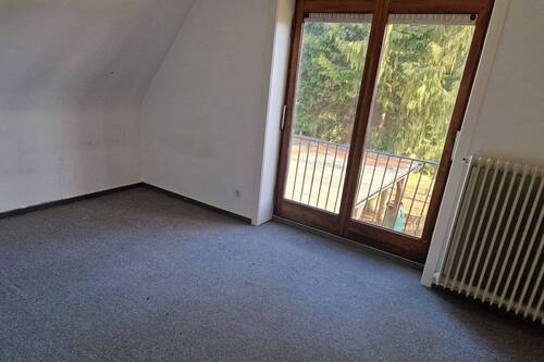 Zimmer im Dachgeschoss - 