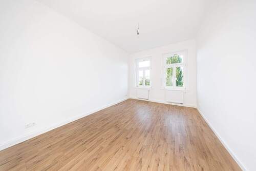 Das Wohnzimmer - 2-Zimmer-Wohnung mit Balkon direkt am Lene-Voigt-Park