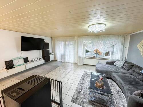 Wohnzimmer im Erdgeschoss - 5 Zimmer Reihenmittelhaus zum Kaufen in Warendorf