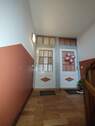 zur Wohnung - 