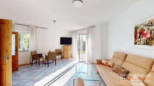 Wohnzimmer der 55 qm Einheit - 