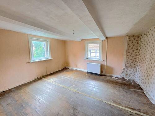 Wohnzimmer - 8 Zimmer Einfamilienhaus zum Kaufen in Liebenburg