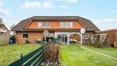 Außenansicht 1 - Attraktives Mehrfamilienhaus mit 4 WEs, Garten und Garagen in Bersenbrück