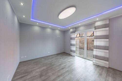 Das Wohnzimmer mit Terrassenzugang - Einfamilienhaus mit 106,70 m&sup2; in Löningen zum Kaufen