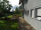 Bild 1 - Schöne Single-Wohnung mit Gartenanteil in Oberschwandorf