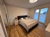 Schlafzimmer mit Zugang zur Terrasse - 