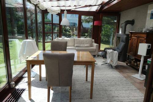 Wintergarten mit Kaminofen - 
