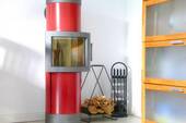 Kachel-Kaminofen im Wohnzimmer - 3 Zimmer Einfamilienhaus zum Kaufen in Wyk-Boldixum