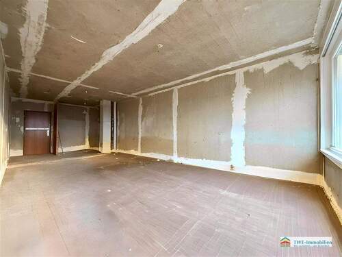 Wohnzimmer mit offener Küche - 2 Zimmer Etagenwohnung zum Kaufen in Kerpen