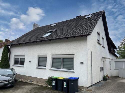 Außenansicht - Eigentumswohnung mit Terrasse und zwei PKW-Stellplätzen