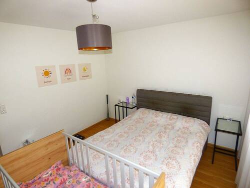 Schlafzimmer mit Zugang zum Balkon - 
