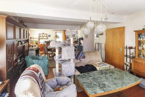 Wohnzimmer EG - 7 Zimmer Einfamilienhaus zum Kaufen in Feldatal