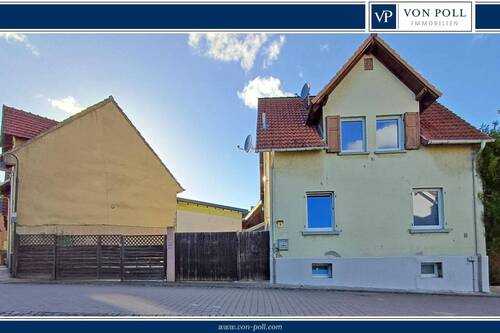 Vorderansicht - Charmantes Einfamilienhaus - überwiegend modernisiert und vielseitig nutzbar!