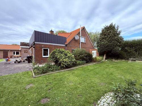 Seitenansicht - 9 Zimmer Mehrfamilienhaus, Wohnhaus in Wangerland / Horum