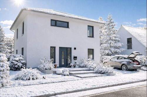 Straßenansicht - Ein Haus wie eine Umarmung: unkompliziert, energetisch sicher & bezahlbar