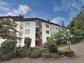 Hauseingang - Stilvolle Eigentumswohnung mit Balkon und Garage auf dem Kieselhumes
