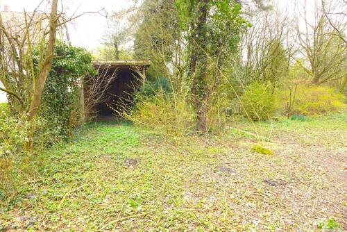Grundstücksansicht mit Carport - Grundstück zum Kaufen in Oldenburg (Oldb)