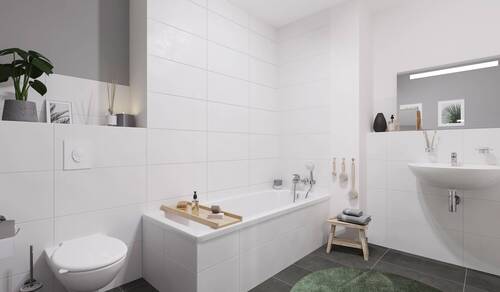 Ein modern gefliestes Badezimmer, inklusive Badewanne - 